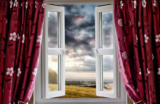 Open window onto landscape fields and clouds