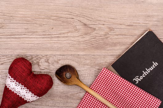Copy space for menu card with cooking spoon,cookbook and heart