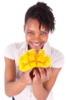 Young happy black / african american woman holding fresh mango isolated on white background