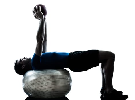 one caucasian man exercising workout fitness ball in silhouette studio  isolated on white background