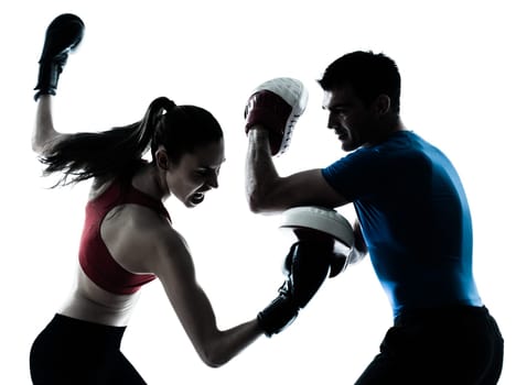 personal trainer man coach and woman exercising boxing silhouette  studio isolated on white background