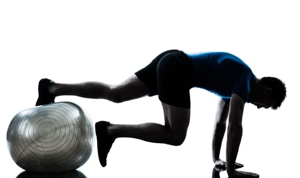 one caucasian man exercising workout fitness ball in silhouette studio  isolated on white background