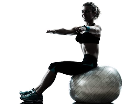 one caucasian woman exercising fitness ball workout posture in silhouette studio isolated on white background