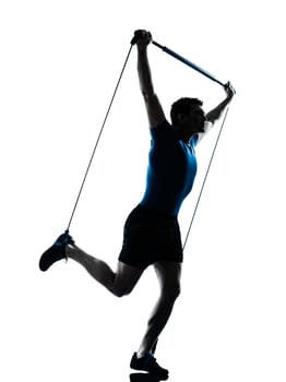 one caucasian man exercising gymstick workout fitness in silhouette studio  isolated on white background