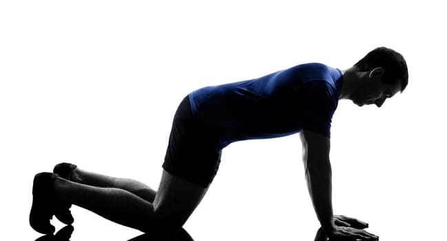 man exercising push ups workout fitness aerobics posture in silhouette studio isolated on white background