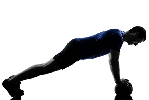 man exercising push ups workout fitness aerobics posture in silhouette studio isolated on white background