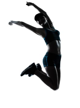 one caucasian woman runner jogger jumping happy jumping in silhouette studio isolated on white background
