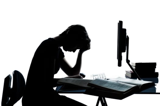 one caucasian young teenager silhouette boy or girl studying with computer computing laptop tired sad despair in studio cut out isolated on white background