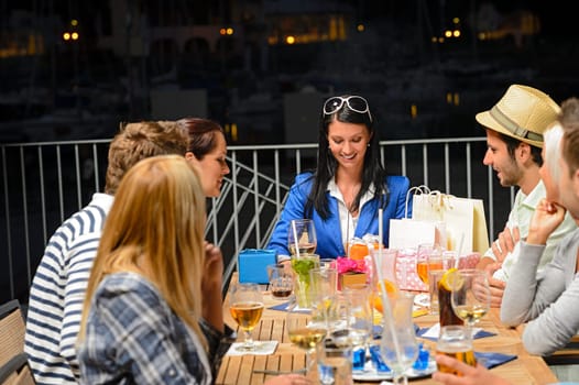 Young friends celebrating outdoors birthday party marina terrace restaurant