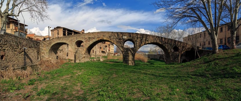 Roman bridge in Vic, Barcelona, Catalonia, Spain It consists of four arches of different sizes.