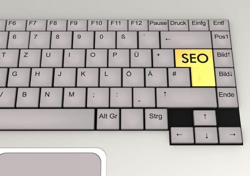 German keyboard of a notebook with golden key SEO.