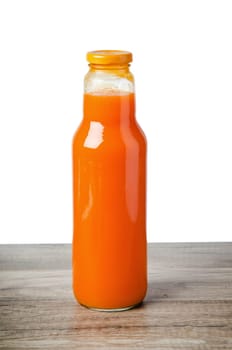 Bottle with carrots juice, it is isolated on white