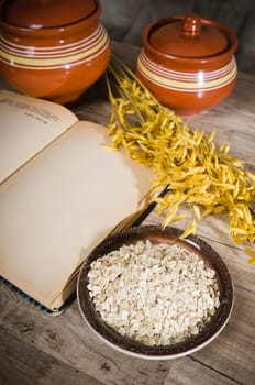 Still life with oatmeal and an open book