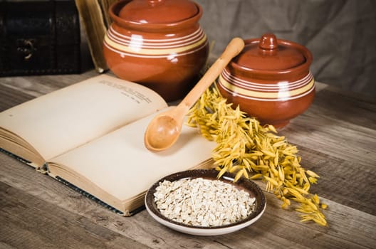 Still life with oatmeal and an open book