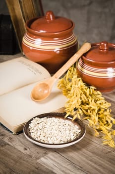 Still life with oatmeal and an open book
