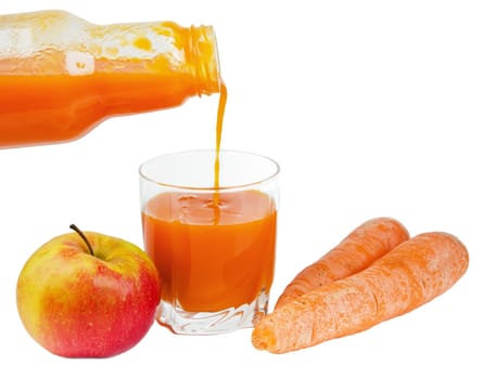 Bottle with carrots juice and an apple