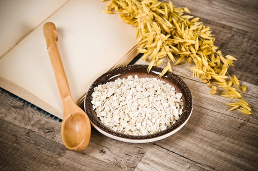 Still life with oatmeal and an open book