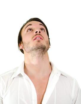 Good looking young man in shirt looking up, isolated on white background