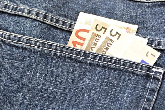 Money in the pocket of a pair of jeans