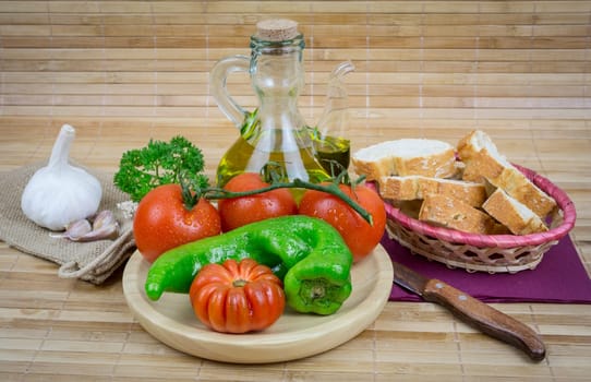 olive oil with garlic and onions on wooden board