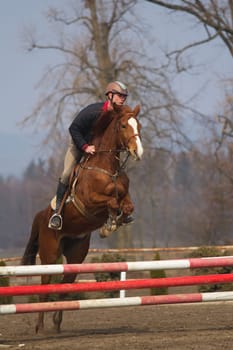 TRESTINA - MAR 30: Jitka Vezelska in action at "The first spring Equestrian Championship"" on March 31, 2013 in Trestina (Czech Republic)"