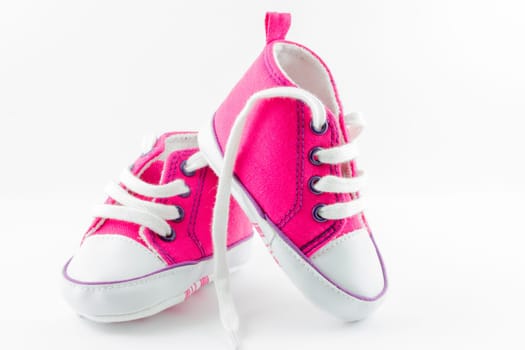 A pair of pink baby sneakers