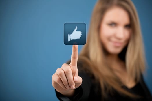 Social media concept. Young woman click on the like button.