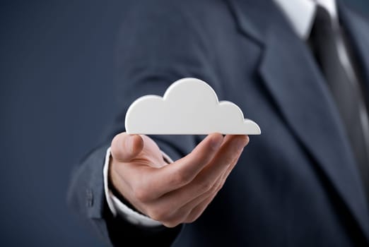 Cloud computing concept. Man hold cloud.