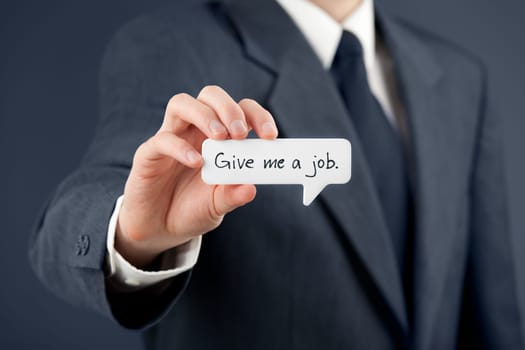 Young businessman hold comics bubble with text Give me a job. Unemployed person (jobless, out of work) concept.
