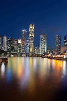 Singapore Central Business District (CBD) City Skyline by Boat Quay Along Singapore River at Blue Hour Vertical