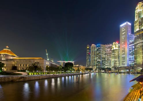 Singapore Central Business District (CBD) City Skyline by Boat Quay Along Singapore River at Night with Laser Light Show