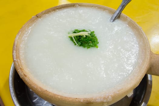 Claypot Chinese Congee Porridge with Chives and Ginger Closeup