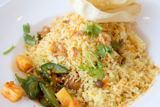Indian Nasi Briyani Rice Dish with Pickled Vegetable and Crackers Local Dish Closeup