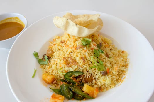 Indian Nasi Briyani Rice Dish with Curry Sauce Pickled Vegetable and Crackers Local Dish