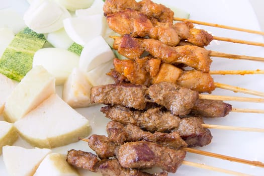 Mutton and Chicken Satay with Chopped Cucumbers Onions and Ketupat Rice Cake Macro