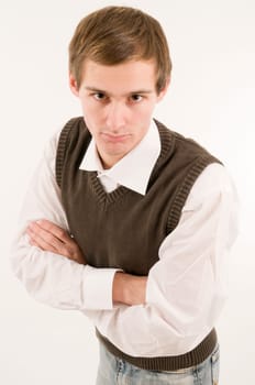 side torso shot of a young man in a white shirt and brown westover with crossed arms  Looking at the camera