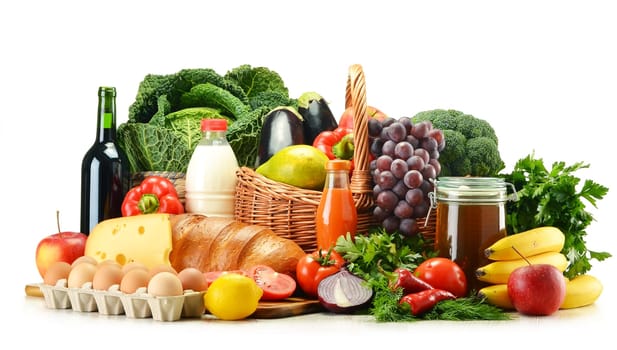 Grocery products including vegetables, fruits, dairy, bread and drinks isolated on white