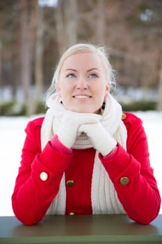 Woman relies at terrace boundary dreaming about somethink