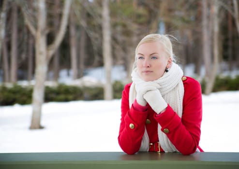 Woman relies at terrace boundary hoping for good
