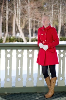 Good picture of woman in coat at terrace