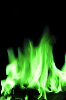 bright green flames on an open fire that give that warm feeling