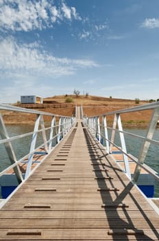 Wooden walkway serving Amieira pier on the banks of the reservoir of Alqueva, Alentejo, Portugal