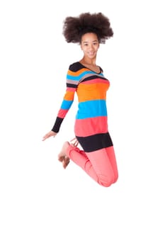 Black African American teenage girl with a afro haircut jumping of joy, isolated on white background