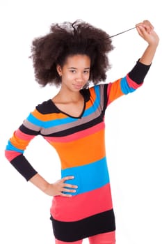 Black African American teenage girl holding her afro hair, isolated on white background