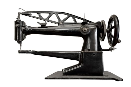 Ancient sewing machine isolated on white background