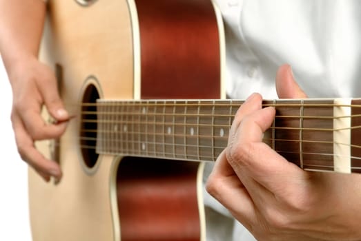 Female guitarist playing on an acoustic guitar,white background