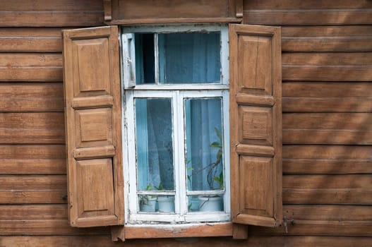 Windows of old traditional russian wooden house. Kostroma, golden ring, Russia.
