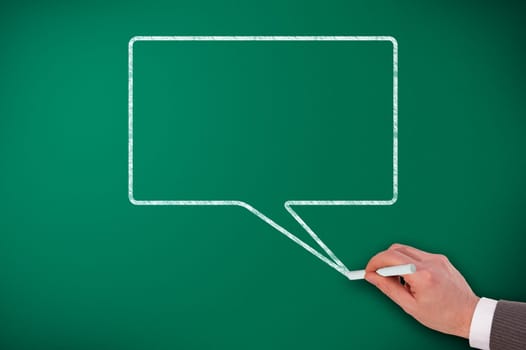 Speech Bubble on blackboard and hand design it