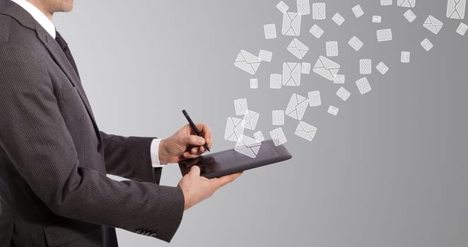 business man write mail on tablet, grey background