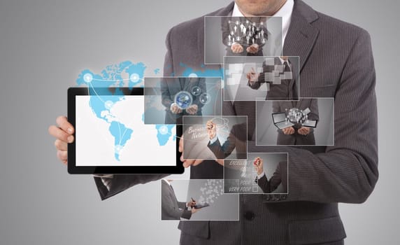 business man holding a tablet, grey background